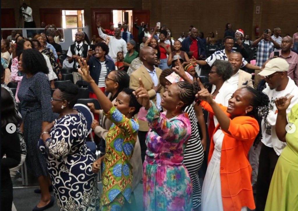 Congregation worshipping together at a crusade